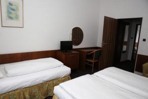 Voodi või voodid majutusasutuse Hotel Skála toas