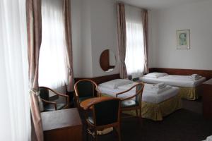 Voodi või voodid majutusasutuse Hotel Skála toas