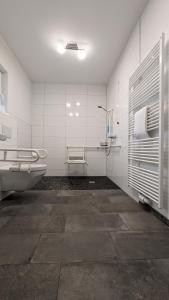 a bathroom with a tub and a sink and a toilet at Altes Ruderhaus in Worms