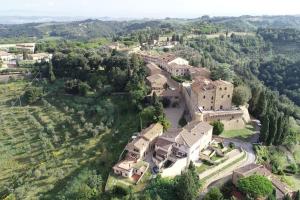 an aerial view of a large house with trees at La Terrazza in Castelfalfi