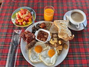 a plate of breakfast food with eggs and toast at Baan Pai Nai Wieng in Pai