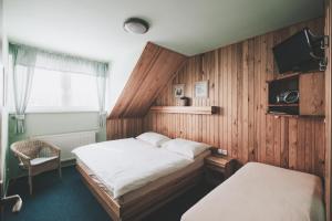 TV a/nebo společenská místnost v ubytování Rodinný resort UKO