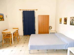 Ένα ή περισσότερα κρεβάτια σε δωμάτιο στο Ca Balena piccola e grande