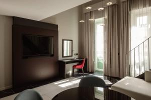TV a/nebo společenská místnost v ubytování Melior Boutique Hotel