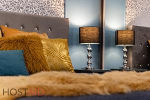 Postel nebo postele na pokoji v ubytování V68 Design Apartment - hostAID