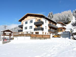a ski lodge in the snow with snow covered ground at Gasthof Bergblick in Berwang