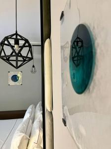 a view of a room with a bat and a mirror at Best Western Plus Sabaudia Hotel in Sabaudia
