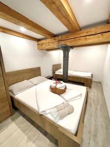 a bedroom with a large bed with a fireplace at The Comfortable Loft in Ljubljana