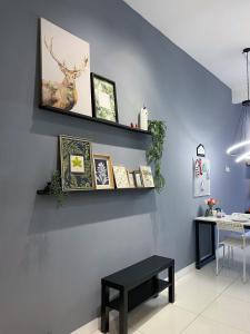 a room with a wall with a shelf and a table at Le Thompson - Puchong Center IOI Mall in Puchong