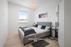 Postel nebo postele na pokoji v ubytování Penthouse Seaview Emilia