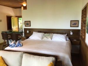Een bed of bedden in een kamer bij Cocolobo Resort
