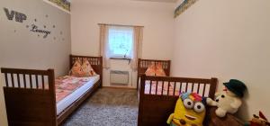 Postel nebo postele na pokoji v ubytování Haus Julia