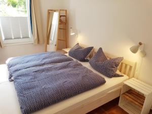 Postel nebo postele na pokoji v ubytování Ferienhaus an der Nordsee - familienfreundlich, gut ausgestattet & viel Platz