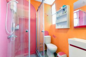 a bathroom with a shower and a toilet and a sink at Shantihome in İzmir +66 photos
