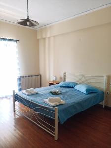 Giường trong phòng chung tại Iren Holiday Apartment