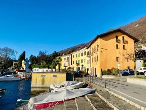a group of boats are docked in a marina at ANGELO Loft in Tremezzo