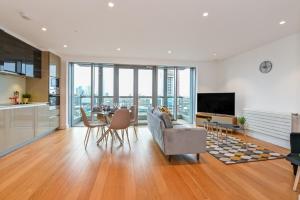 a living room with a couch and a table at CannySuite 1BED in London