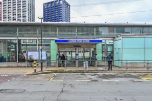 a man standing in front of a train station at CannySuite 1BED in London