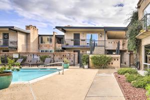 a backyard with a swimming pool and a house at Scottsdale Condo about 2 Mi to Downtown! in Scottsdale