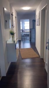 a hallway of a home with a kitchen and a living room at Ferienwohnung Lipp in Waldstetten