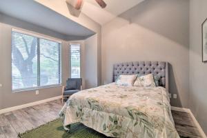 a bedroom with a bed and a chair and a window at Private Pool and Community Perks Mesa Home! in Mesa +22 photos