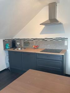 a kitchen with a sink and a counter top at Ferienwohnung Lipp in Waldstetten