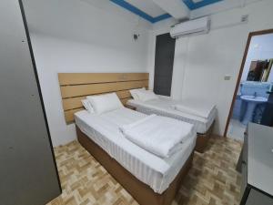 Postel nebo postele na pokoji v ubytování Villagewaves + 7 fotografií