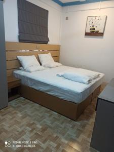 Postel nebo postele na pokoji v ubytování Villagewaves
