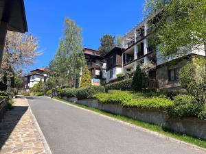 an empty street next to an apartment building at Cosy Apartment with Sea view in Santa Marina in Sozopol