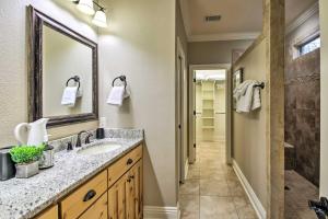 a bathroom with a sink and a mirror at Spacious Golf Course Getaway in Hot Springs! in Hot Springs Village +22 photos