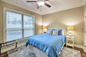 a bedroom with a bed and a ceiling fan at Spacious Golf Course Getaway in Hot Springs! in Hot Springs Village