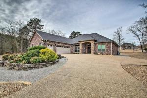 a brick house with a driveway in front of it at Spacious Golf Course Getaway in Hot Springs! in Hot Springs Village