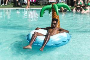 a man is laying on an inflatableigunigunigunigunigunigunigun at BC Music Resort in Benidorm