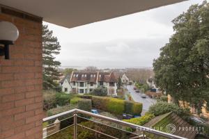 a view from the balcony of a house at 2 bed, 2 bath apartment, balcony with sea and island views, parking - Island Views in Poole
