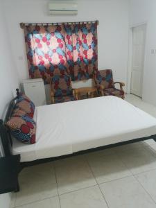 Cama ou camas em um quarto em TRANQUIL RESORT HOTEL