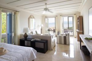 a living room with a bed and a couch at Anassa in Polis Chrysochous +37 photos