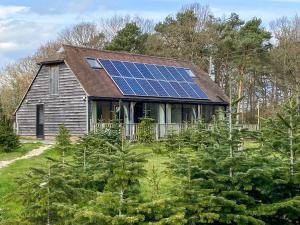 a house with solar panels on the roof at The Old Carthouse in Steyning