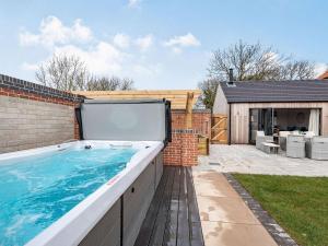 a swimming pool in the backyard of a house at Copper House in Willoughby