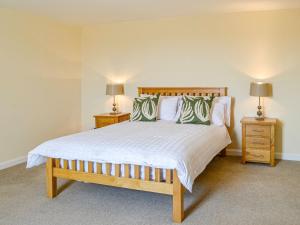 Un pat sau paturi într-o cameră la Mullhill