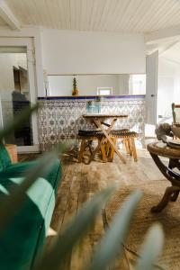 a living room with a table and two chairs at Olympo Shared flat with Amazing River view in Lisbon