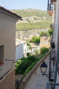 a view from an alley between two buildings at Cuencaloft Casa S-XVII "La Catedral" in Cuenca
