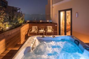a jacuzzi tub in the middle of a house at The Blossom Collection in Heraklion City Center in Heraklio Town