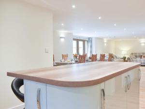 a kitchen and dining room with a counter top at North Barn in Monk Okehampton