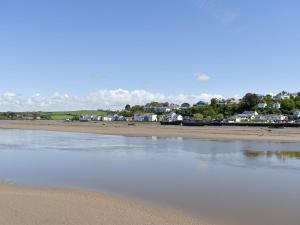 a view of a beach with houses in the background at Number One Bideford in Bideford