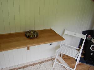 a table with a chair and a bowl on it at Beunos Hut -ukc4752 in Tremeirchion