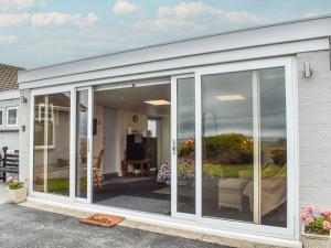 an extension of a house with sliding glass doors at Lynch Annexe in Appledore