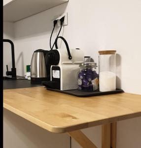 a counter with a toaster on a wooden counter top at Skyview Studio in Kerkini