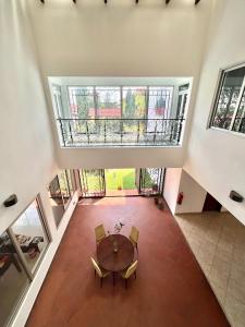 an overhead view of a dining room with a table and chairs at The Dzorwulu Castle - A Villa with private rooms in Accra