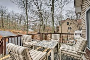 a porch with chairs and a table on a deck at Lackawaxen Family Home with Lake Access! in Lackawaxen