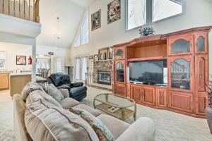 a living room with a large wooden entertainment center at Lackawaxen Family Home with Lake Access! in Lackawaxen